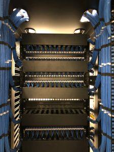 Bundles of data cables leading to a data rack